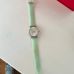 Light green minimal swatch watch